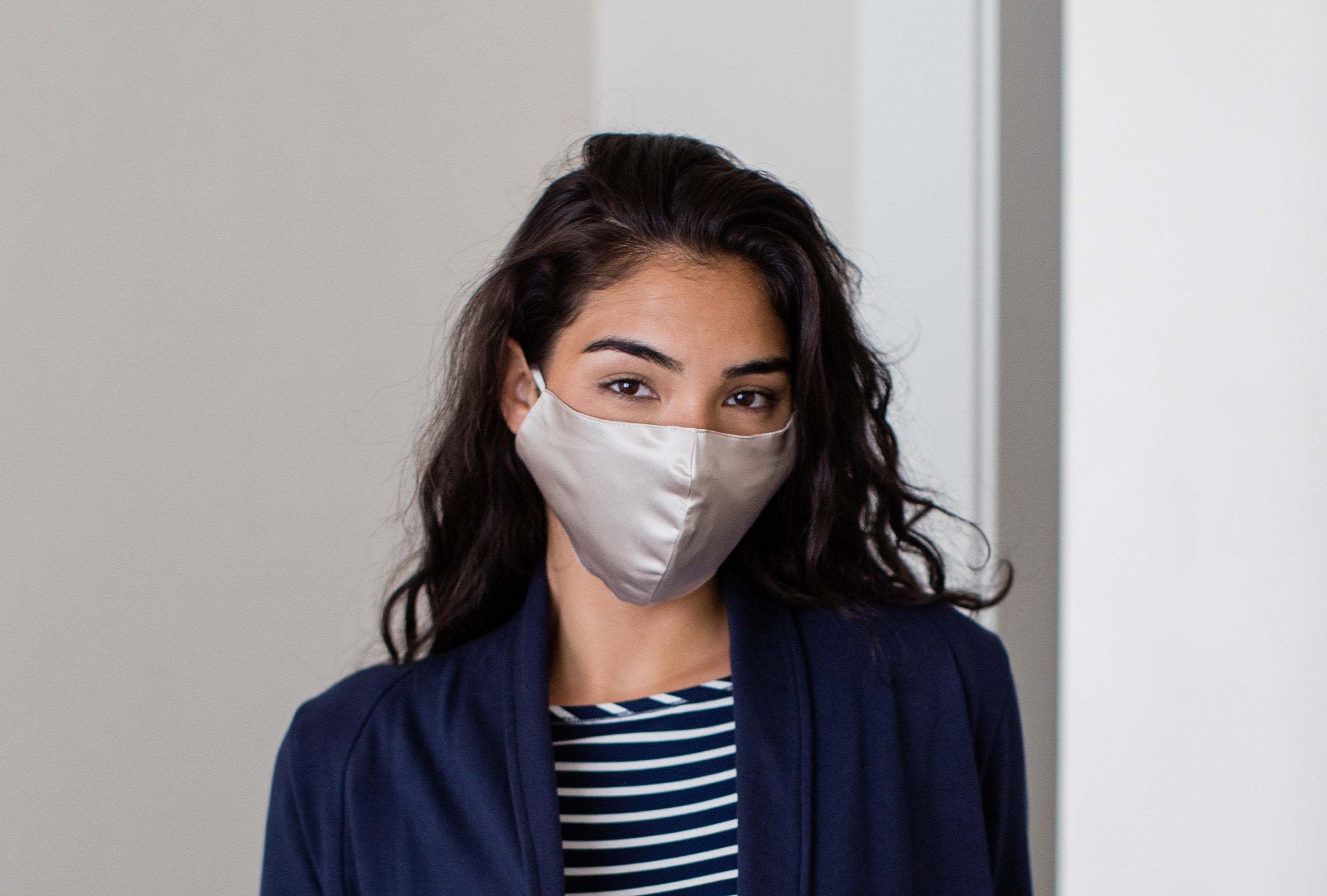 Woman wearing a silk face mask.