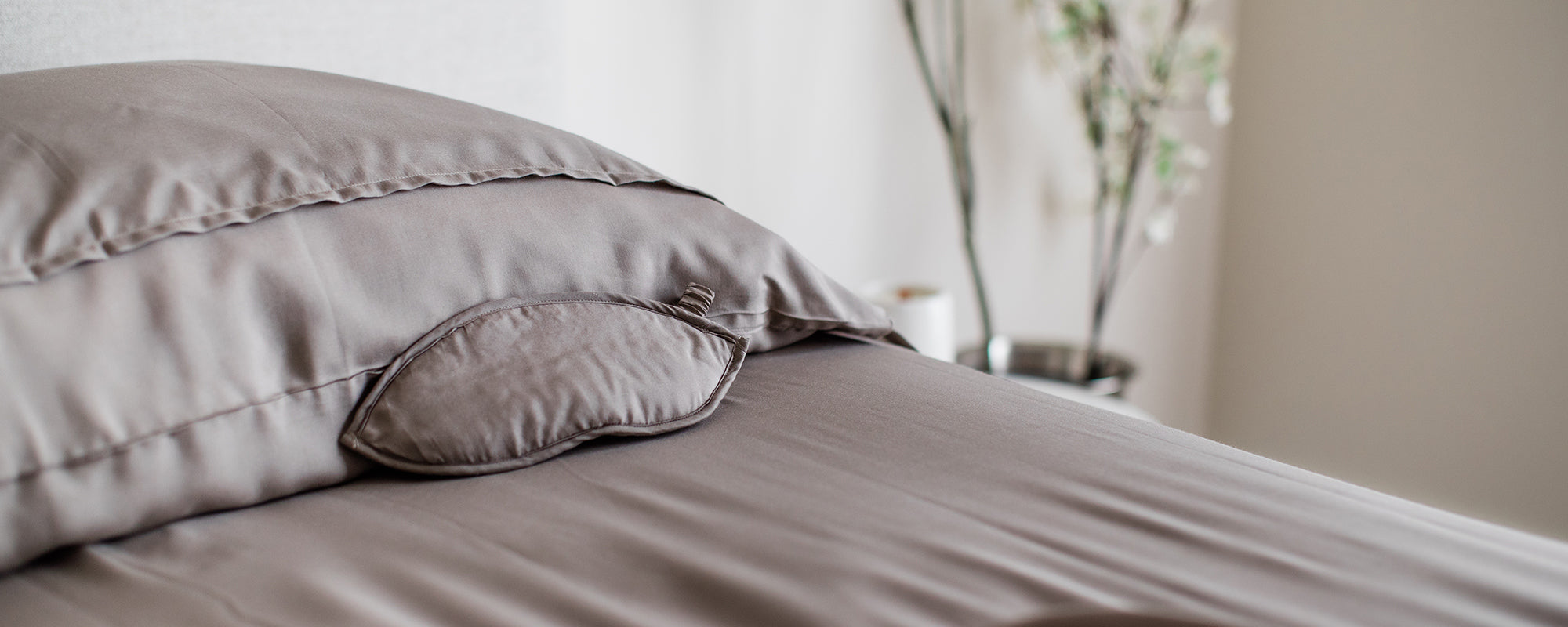 khaki colored silk and bamboo sleepsack called the DreamSack with matching eyeshade for sleep