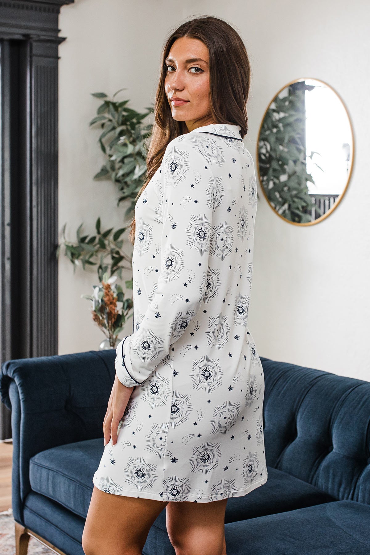 A woman from behind standing and looking back over her shoulder, wearing Yala Amber Classic Button Front Nightshirt