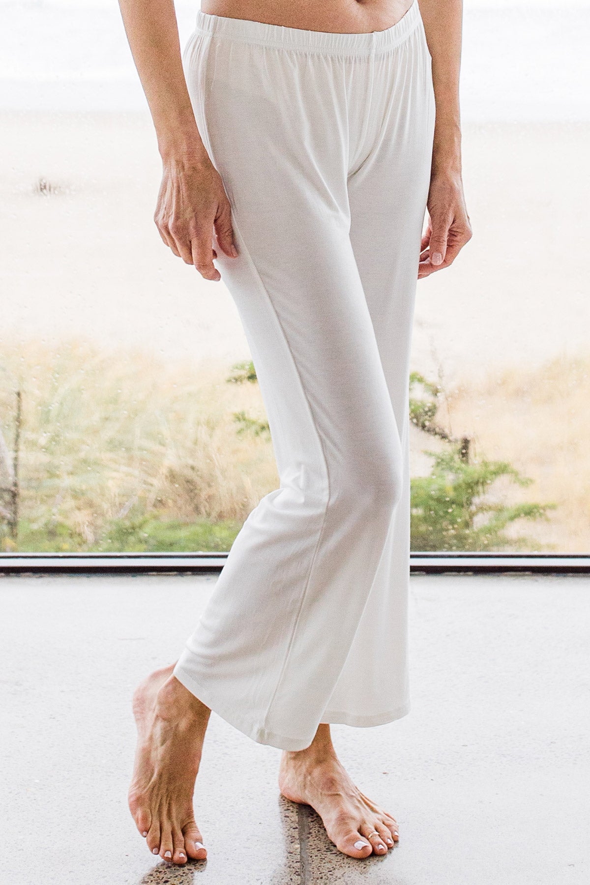 Close Shot of a woman's legs, wearing Yala Delia Gathered Tank Bamboo Pajama Set in Natural