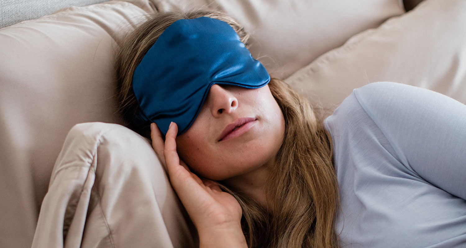 Woman sleeping in cozy YALA Bamboo PJ's and bedding.