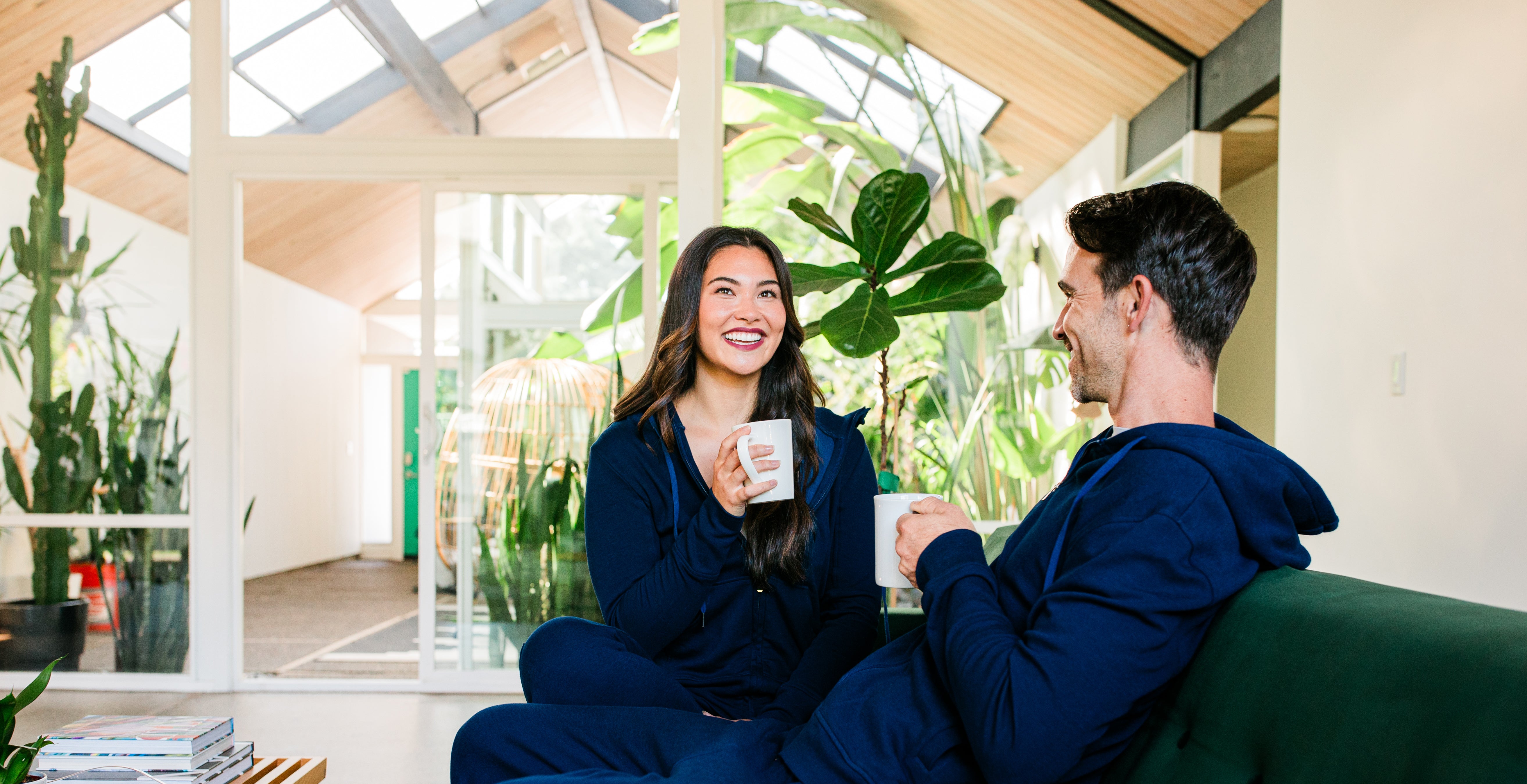 Man and woman having a conversation on a couch.