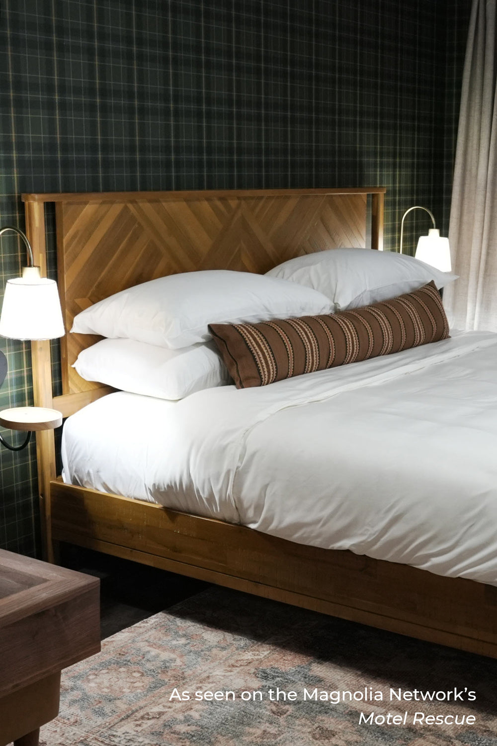 Crisp bamboo sheets folded on a linen-draped bed