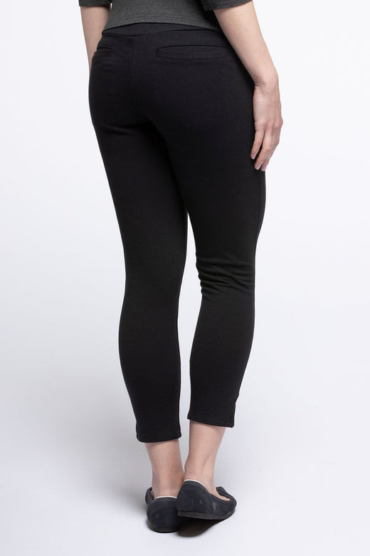 Close shot of a woman's hips and legs from behind, wearing Yala Audrey Cropped Bamboo and Organic Cotton Pencil Pants in Black