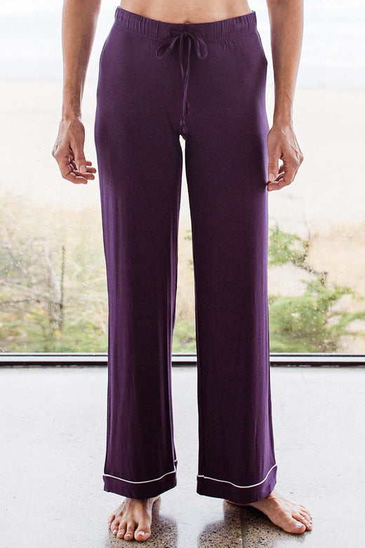 Close shot of a woman's legs, wearing Yala Amber Classic Button Front Bamboo Pajama Set in Aster